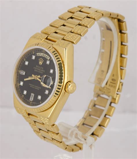 rolex day date oysterquartz.